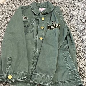 Brand - Justice.   Gold buttons on sleeves and up and down